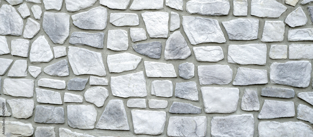 Stones Wall Texture, Abstract background. Grey granite wall background. Stacked rough cut stone wall texture background.