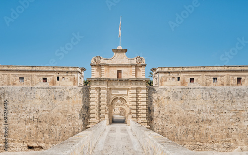 Entrance bridge and gate to Mdina, a fortified medieval city in the northern region of Malta. (digital manipulation)