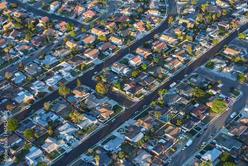 Late afternoon aerial view of suburban neighborhood streets and homes near Los Angeles in Simi Valley, California.