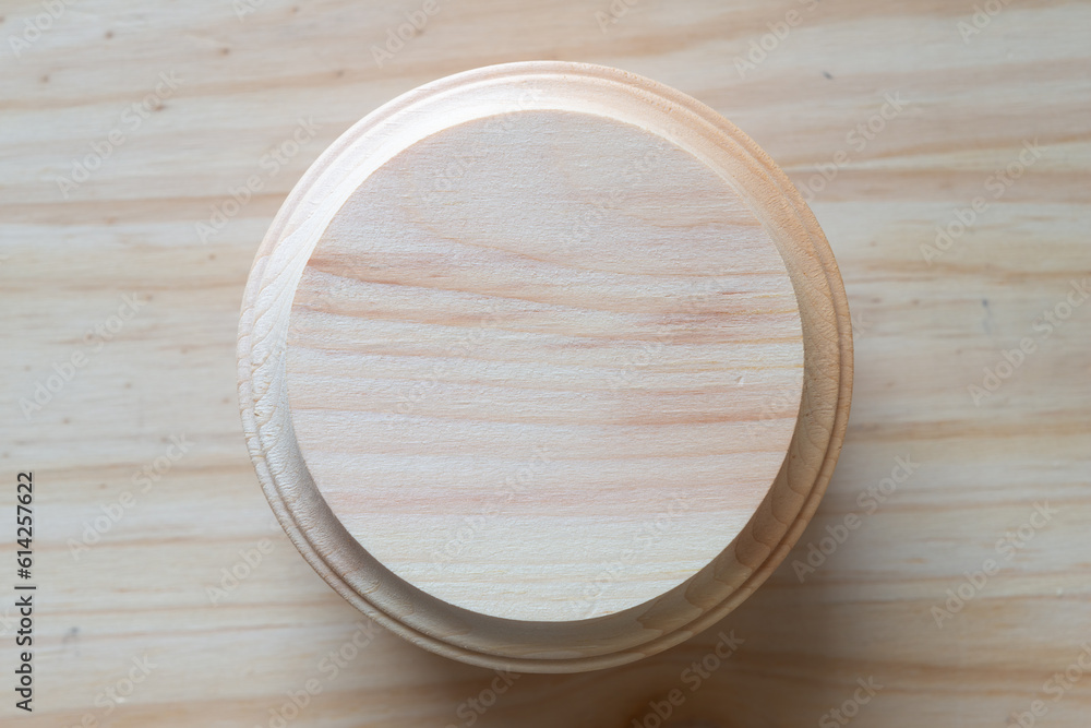 machine-cut round wooden shape with routed edge on wood machine-cut round wooden shape with routed edge on wood