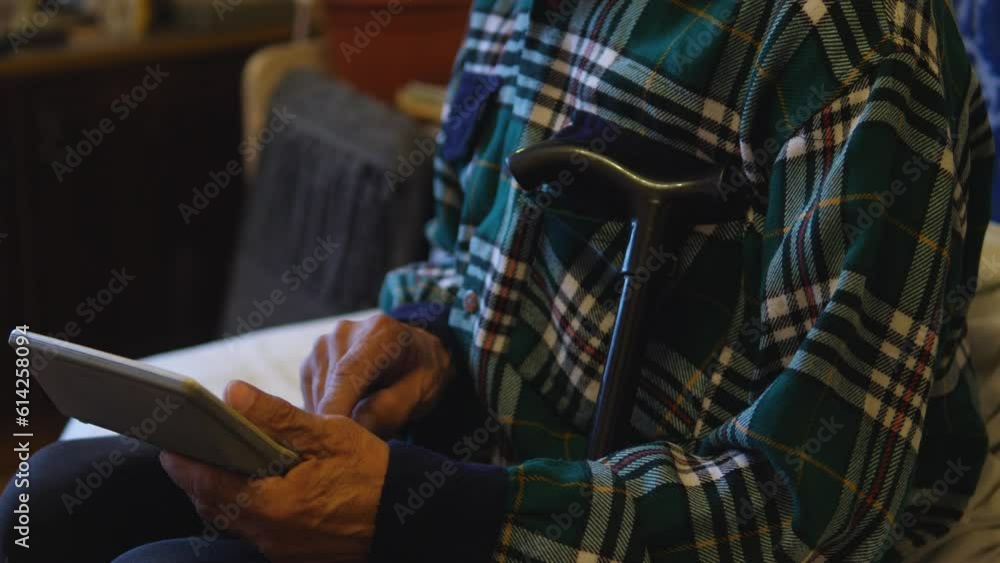 a pensioner counts on a calculator while inside. an elderly person calculates the family budget. financial expenses of an old man, bankruptcy, savings a pensioner counts on a calculator while inside. an elderly person calculates the family budget. financial expenses of an old man, bankruptcy, savings