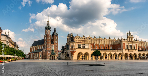 POLAND, KRAKOW. Breathtaking eastern european cobbled square arched building, on a cloudy day in Krakow Poland on July 01, 2015