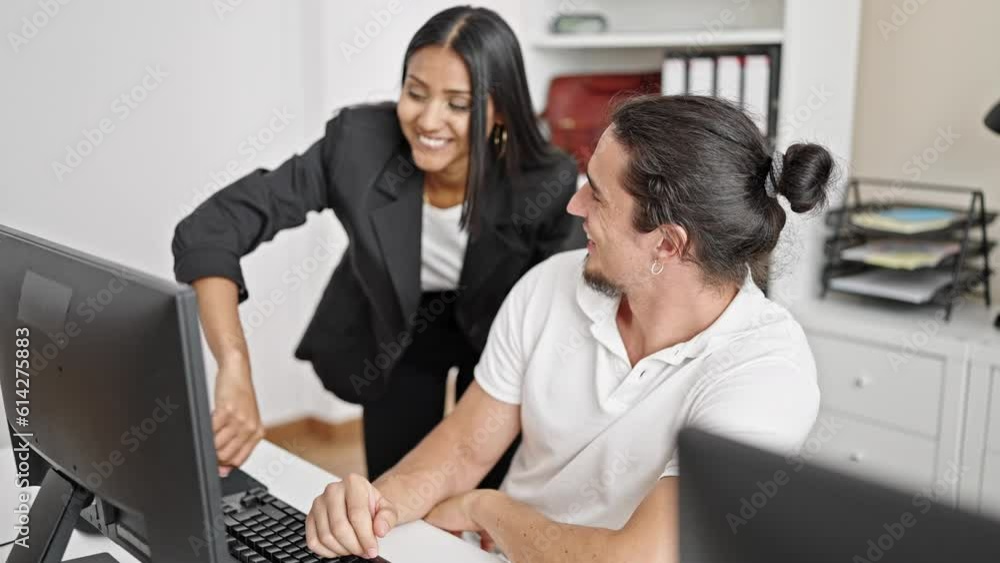 Man and woman business workers shake hands working at office