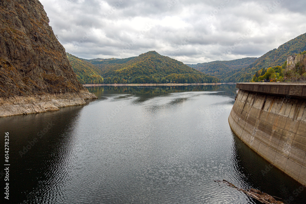 Landscape of mountains and reflection in dam reservoir. Dam Vidrau on Transfagarash highway