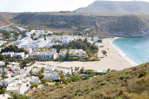Beach and village of Agua Amarga, Cabo de Gata in the province of Almeria, Andalusia, Spain. photo