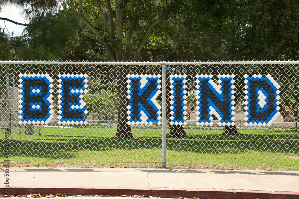 Fototapeta premium positive message on the school yard fence