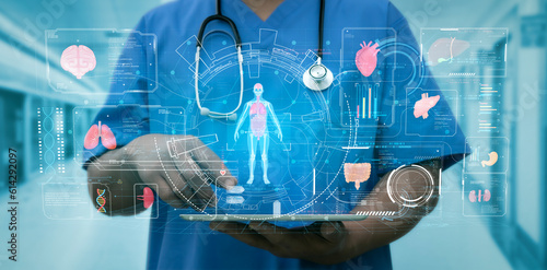 Doctor touch hologram of human system. Medical future technology and innovative concept. The concept support the health of the internal organs of the body.Modern medicine,healthcare,medical insurance