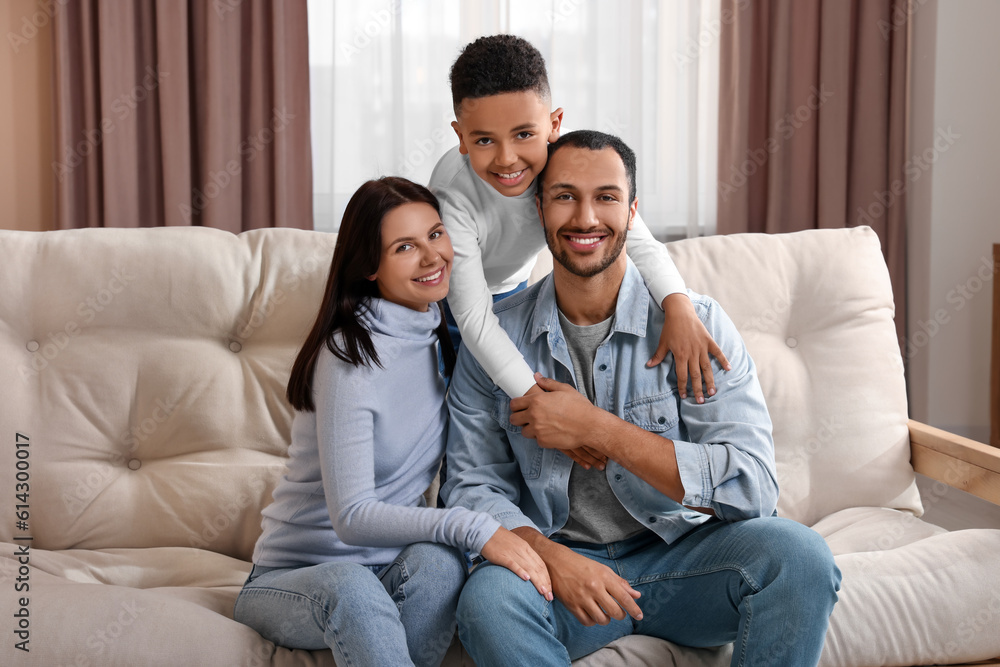 Happy international family on sofa at home Happy international family on sofa at home