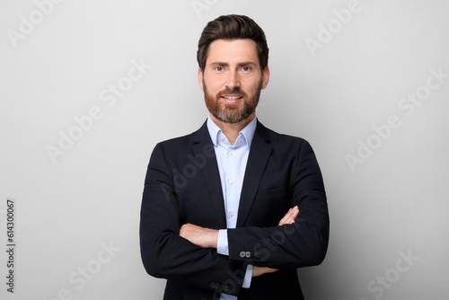 Portrait of handsome man on light grey background