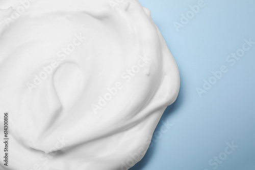 Canvas Print Sample of shaving foam on light blue background, top view