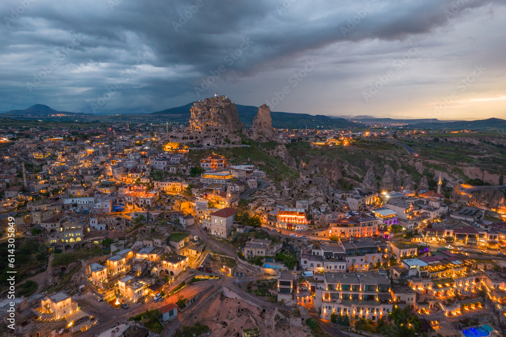 Cappadocia and uchisar castle during sunset with dramatic clouds panorama