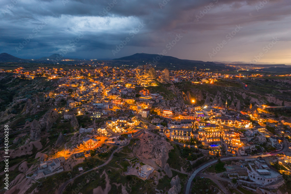Cappadocia and uchisar castle during sunset with dramatic clouds panorama