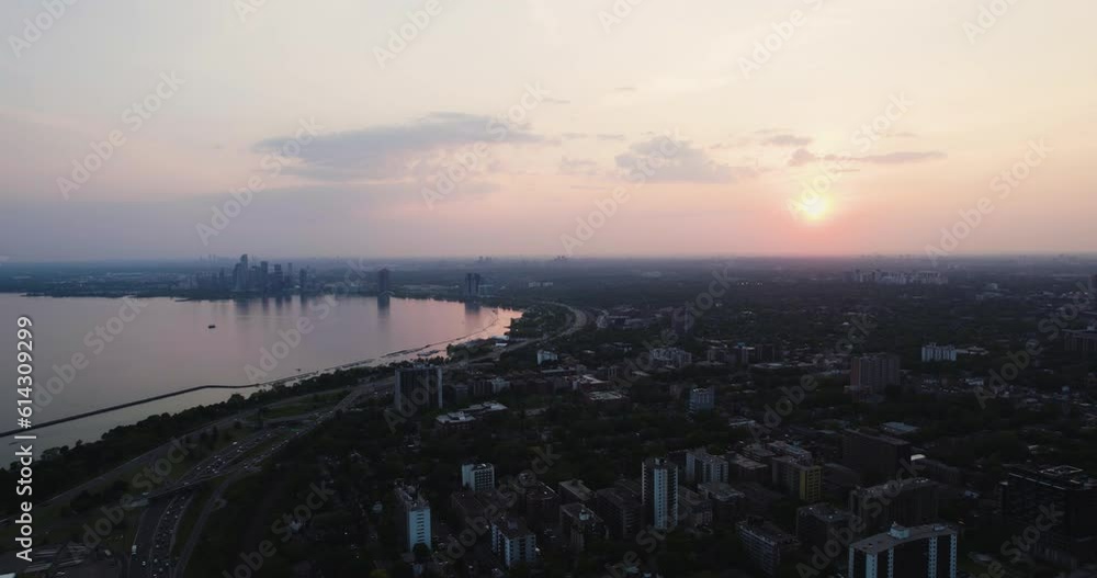 Aerial view backwards over the Parkdale district and Lake Ontario, sunset in Toronto, Canada Aerial view backwards over the Parkdale district and Lake Ontario, sunset in Toronto, Canada