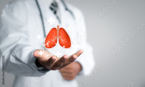 Doctor examining the health of the patient's lungs. Pulmonologist doctor, lungs specialist. Diagnostic concept. photo