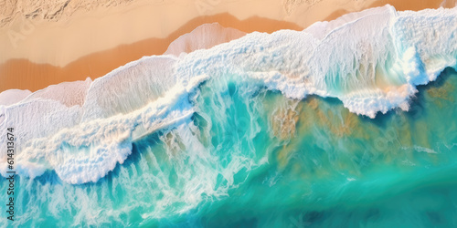 Overhead photo of crashing waves on the shoreline. Tropical beach surf. Abstract aerial ocean view