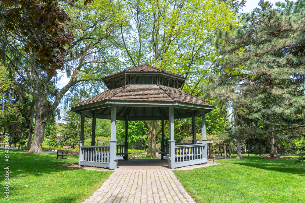 Rosetta McClain Gardens cabin shade made of wood and surrounded by gardens trees. Picturesque public garden located in Scarborough, Ontario, Canada. Scarborough Bluffs area. Rosetta McClain Gardens cabin shade made of wood and surrounded by gardens trees. Picturesque public garden located in Scarborough, Ontario, Canada. Scarborough Bluffs area.