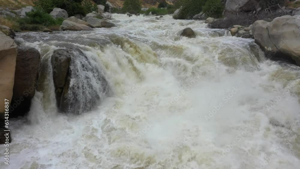 flying slowly up the kern valley river off highway 178 to lake isabella with the white water raging flooding flying slowly up the kern valley river off highway 178 to lake isabella with the white water raging flooding