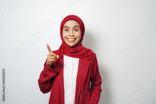 Asian business Muslim woman ini red casual smiling happy and looking confident