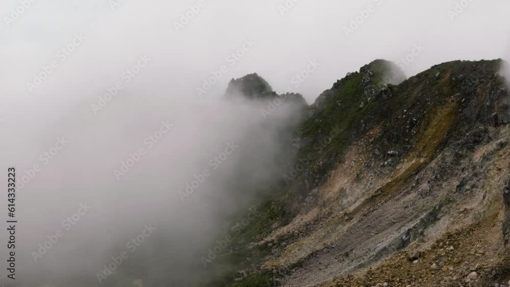 Active volcano crater Sibayak in clouds and mist. Sumatra, Indonesia. Active volcano crater Sibayak in clouds and mist. Sumatra, Indonesia.