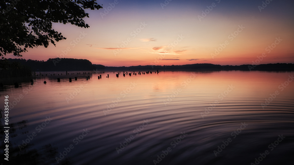 See im Abendrot - Sunset - Landscape - Beautiful Sunset scene over the lake and silhouette hills in the background - Sunrise over sea - Colorful - Reed - Clouds - Sky - Sundown - Sun	