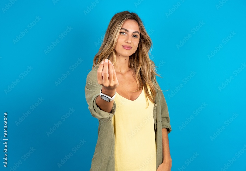 Fototapeta premium young beautiful blonde woman wearing overshirt Doing Italian gesture with hand and fingers confident expression
