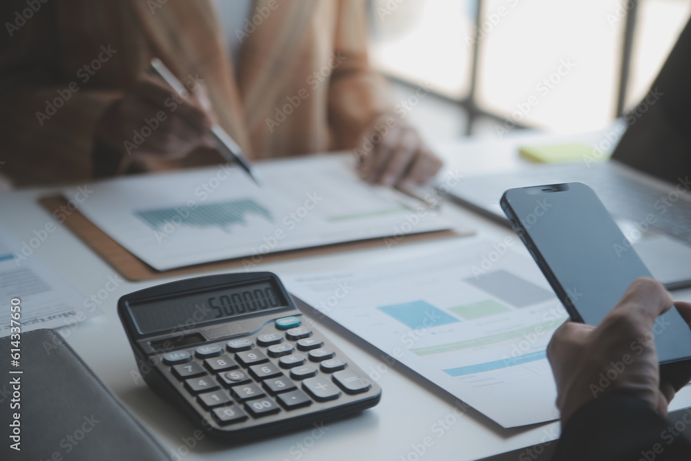 Audit concept,Administrator business man financial inspector and secretary making report calculating balance. Internal Revenue Service checking document. Audit concept,Administrator business man financial inspector and secretary making report calculating balance. Internal Revenue Service checking document.