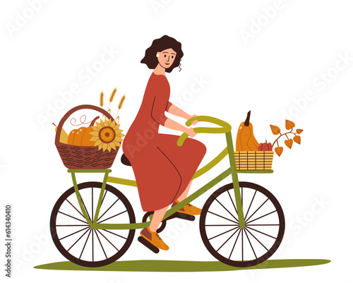 Girl rides bicycle with harvest in basket, harvest of autumn vegetables.