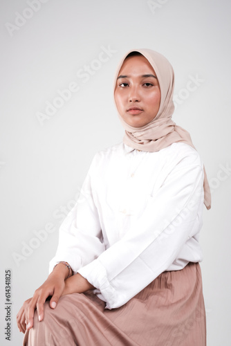 Fashion portrait of young beautiful asian muslim woman with wearing hijab isolated on white background. 