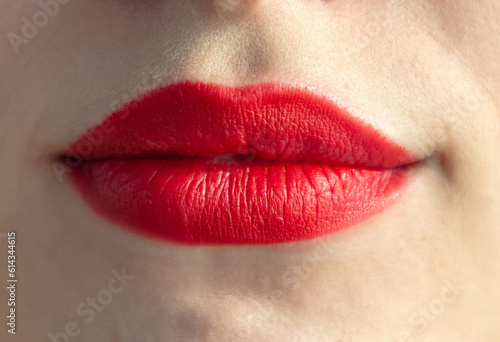 Close up of woman's lips with red lipstick, isolated on white