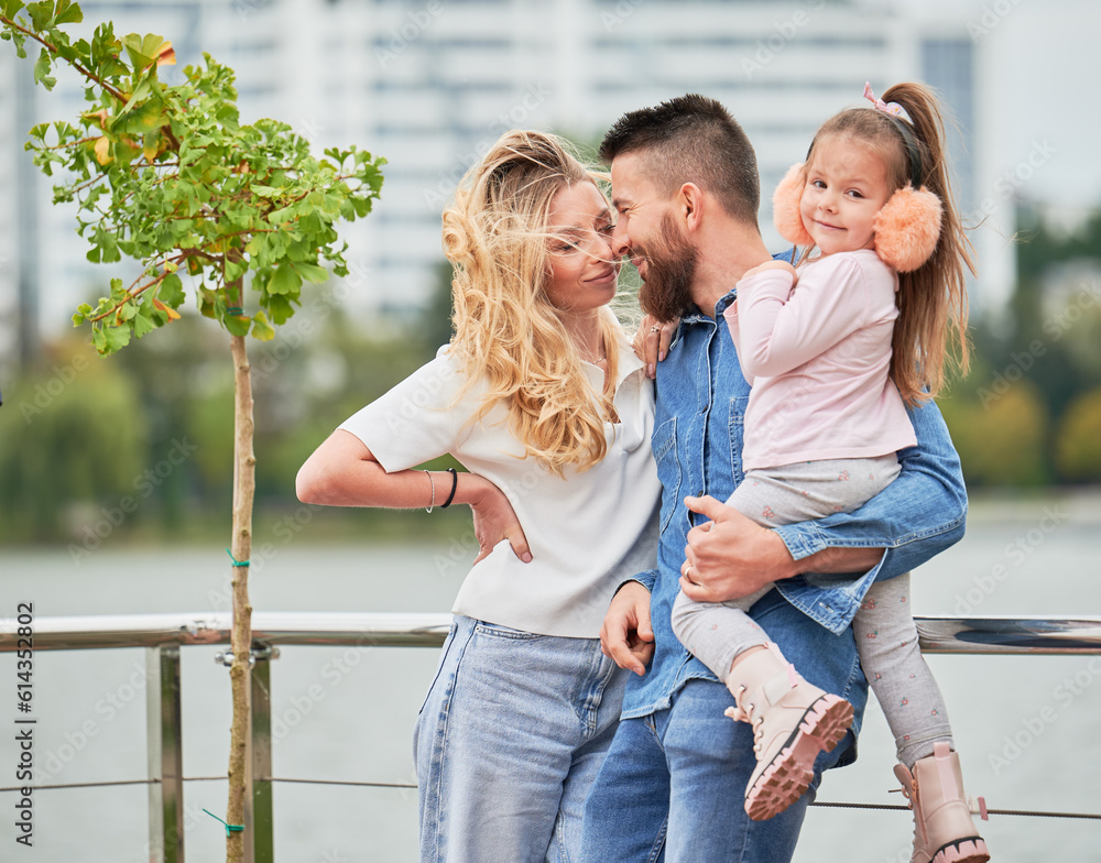 Foto de Man and woman with child outdoors. Father holding adorable ...