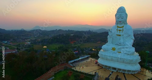 Aerial view beautiful sunset The white big Guanyin statue the biggest in the world at Wat Huay Pla Kang..beautiful Chinese temple wat Huay Pla Kang at Chiang Rai north of Thailand. colorful sky photo