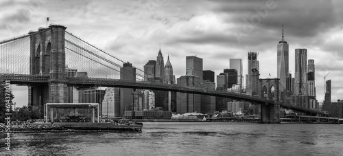 Brooklyn Bridge with Manhattan skyline in the background  in black and white © peresanz