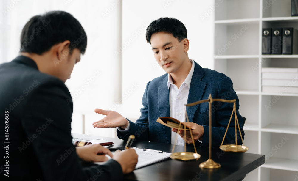 Asian business team and lawyers discussing contract papers sitting at the table. Concepts of law, advice, legal services. at office Asian business team and lawyers discussing contract papers sitting at the table. Concepts of law, advice, legal services. at office