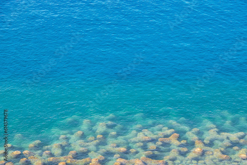 transparent blue sea background © laudibi