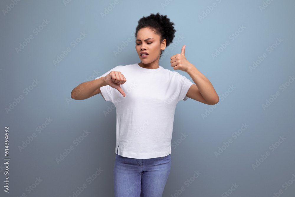 confused owner of curly hair woman dressed in a white t-shirt confused owner of curly hair woman dressed in a white t-shirt