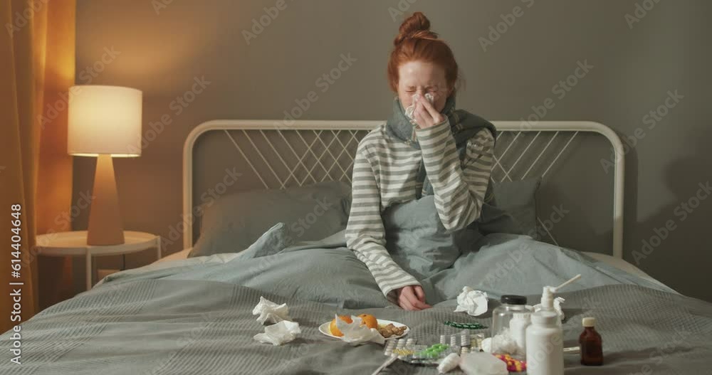 ill upset redhead young woman blowing running nose got flu caught cold