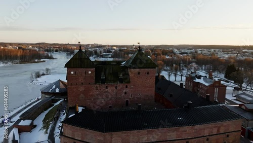 Aerial view in front of the Hame fortress and lake Vanajavesi, winter evening in Hameenlinna, Finland photo