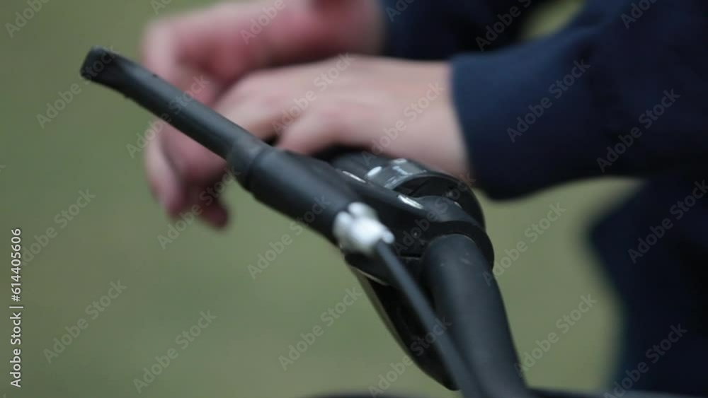 Man checking in slow motion bike handlebars gears after been repaired Man checking in slow motion bike handlebars gears after been repaired