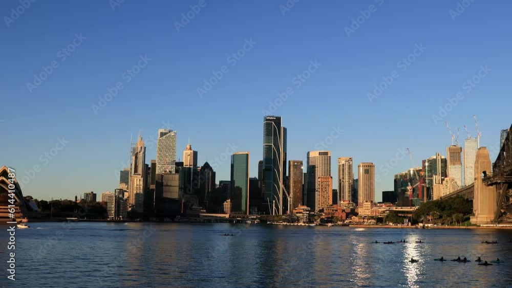 Waterfront of Sydney city CBD landmarks on harbour by the Bridge as 4k.
Waterfront of Sydney city CBD landmarks on harbour by the Bridge as 4k.
