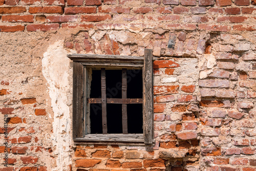 Old red brick castle wall and old window