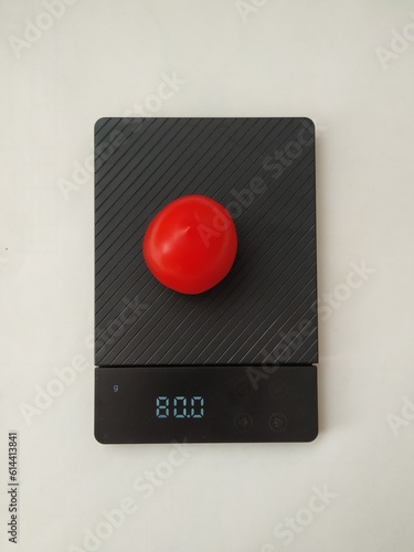 tomato on scales, diet concept, proper nutrient 