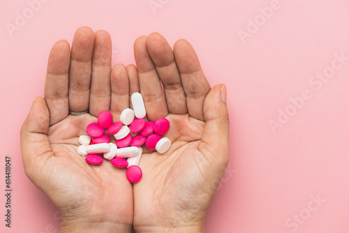 Hand holding medicine pills...