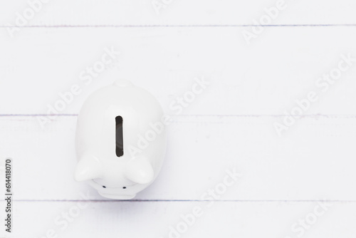 Saving piggy bank on white ...