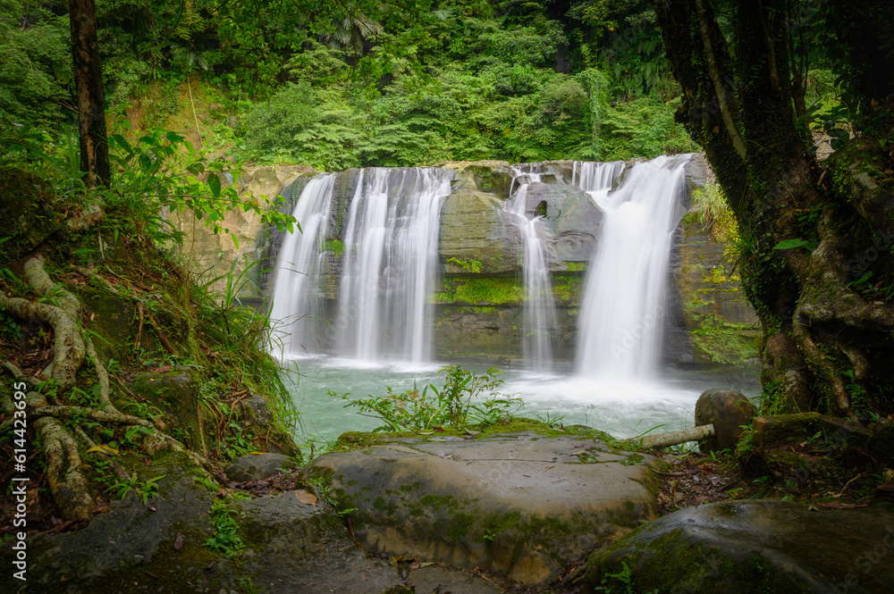 Obraz premium Its large cliffs are popular for jumping, and there is a safe swimming pool. Lingjiao Waterfall is located in Pingxi District, New Taipei City