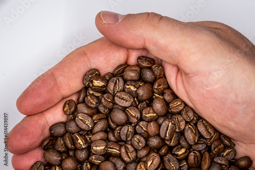 coffee beans in hand half