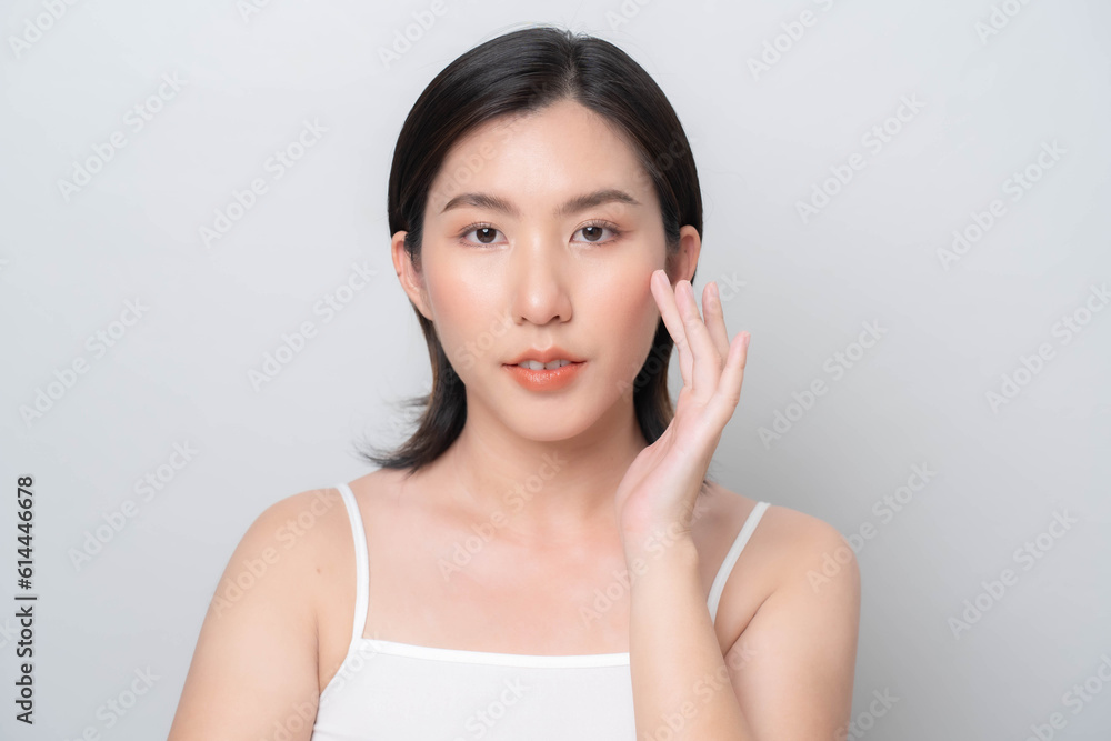 Asian woman touching her face with hands.Facial skin care concept. skin care Asian woman touching her face with hands.Facial skin care concept. skin care