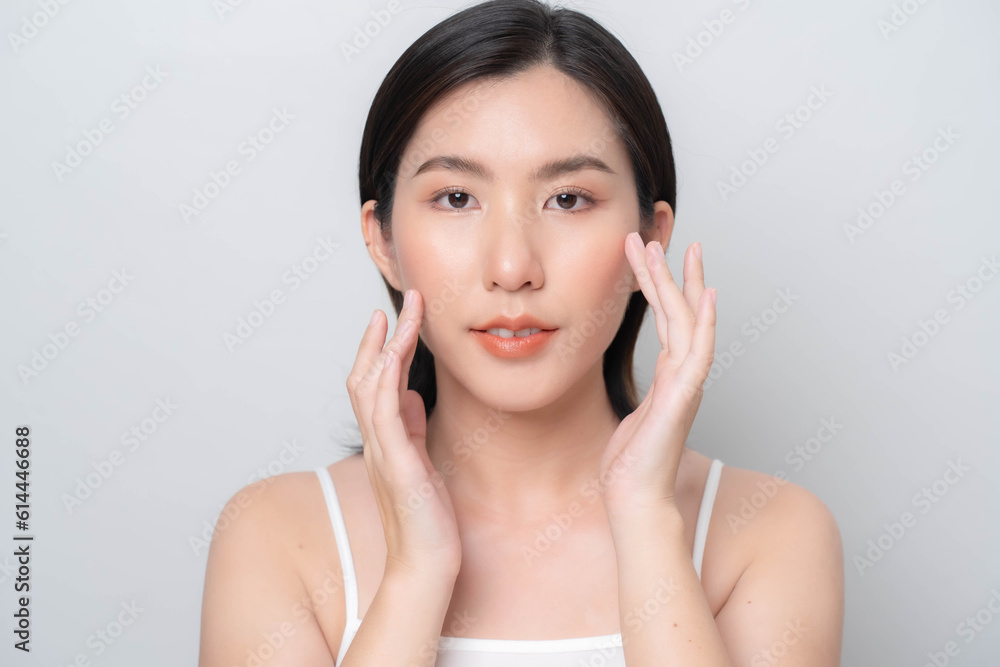 Asian woman touching her face with hands.Facial skin care concept. skin care Asian woman touching her face with hands.Facial skin care concept. skin care