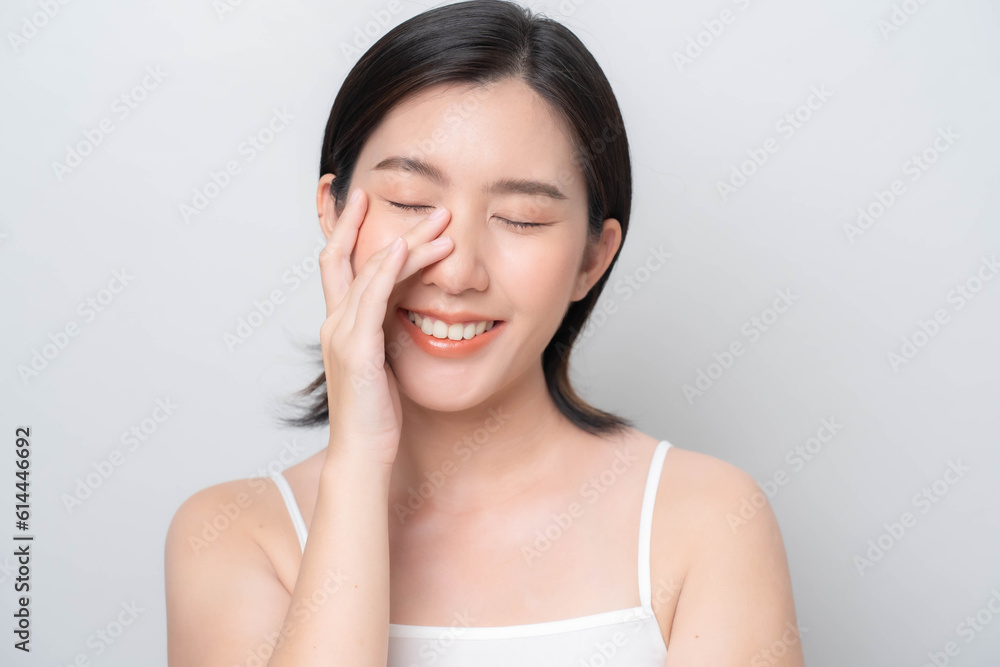 Asian woman touching her face with hands.Facial skin care concept. skin care Asian woman touching her face with hands.Facial skin care concept. skin care