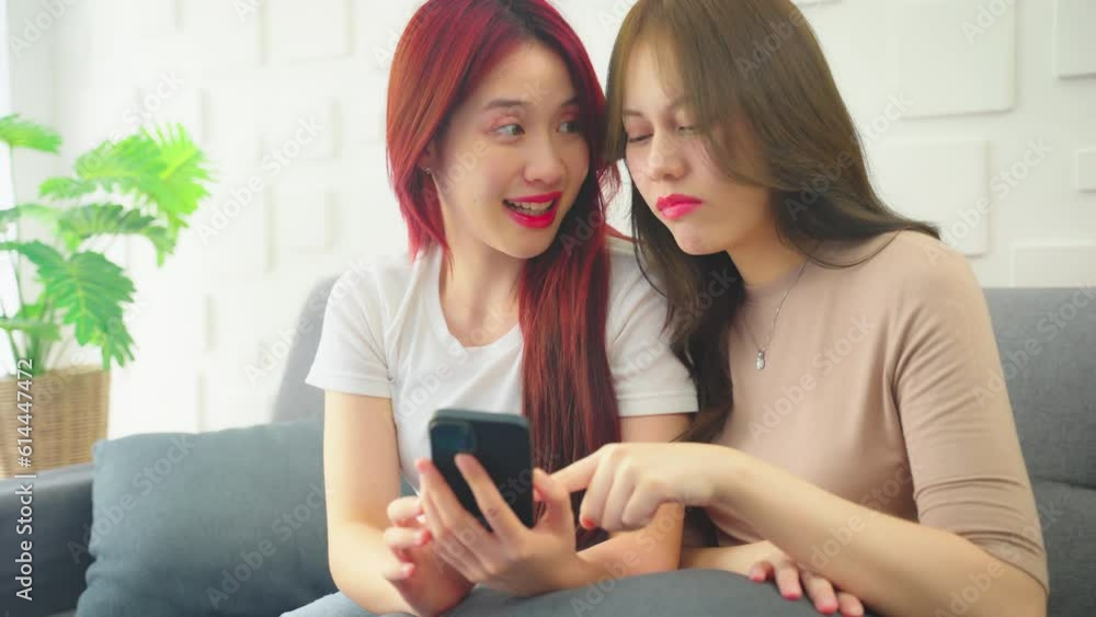 Young woman using phone at home. She using phone to search product at online store. Young woman using phone at home. She using phone to search product at online store.