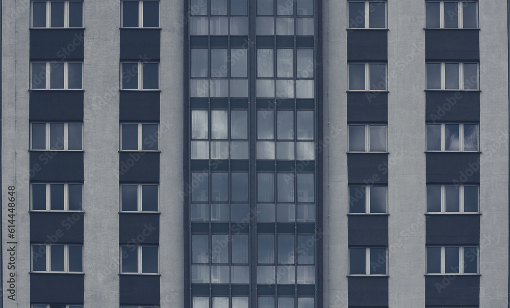 Gray windows of an apartment building. Abstract urban background.